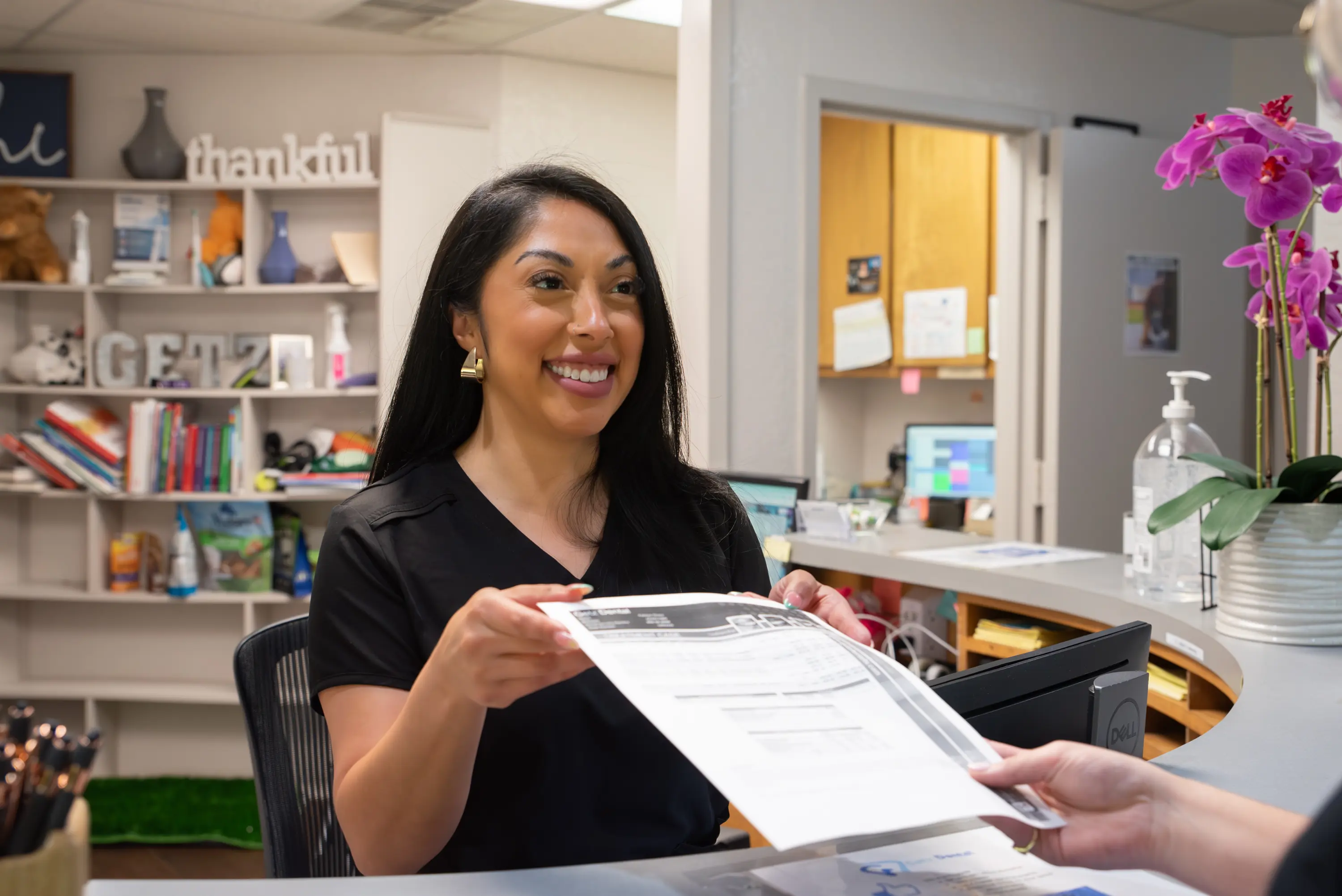 Dentist showing the screen to the patient